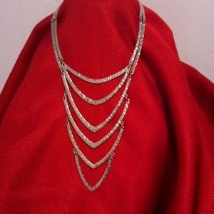 Silver string necklace.